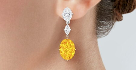 Earrings featuring a pair of exceptionally large fancy vivid orange-yellow diamonds, weighing 12.20 carats and 11.96 carats are to be sold at Christie's New York.