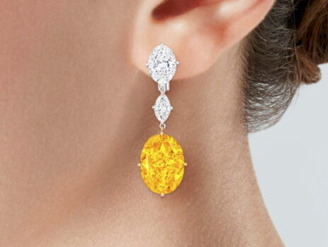 Earrings featuring a pair of exceptionally large fancy vivid orange-yellow diamonds, weighing 12.20 carats and 11.96 carats are to be sold at Christie's New York.